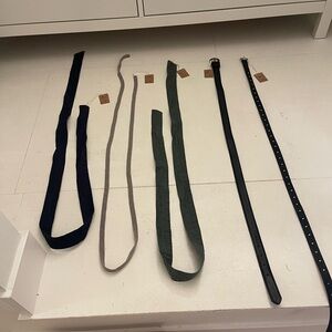 Two black belts and 3 sashes